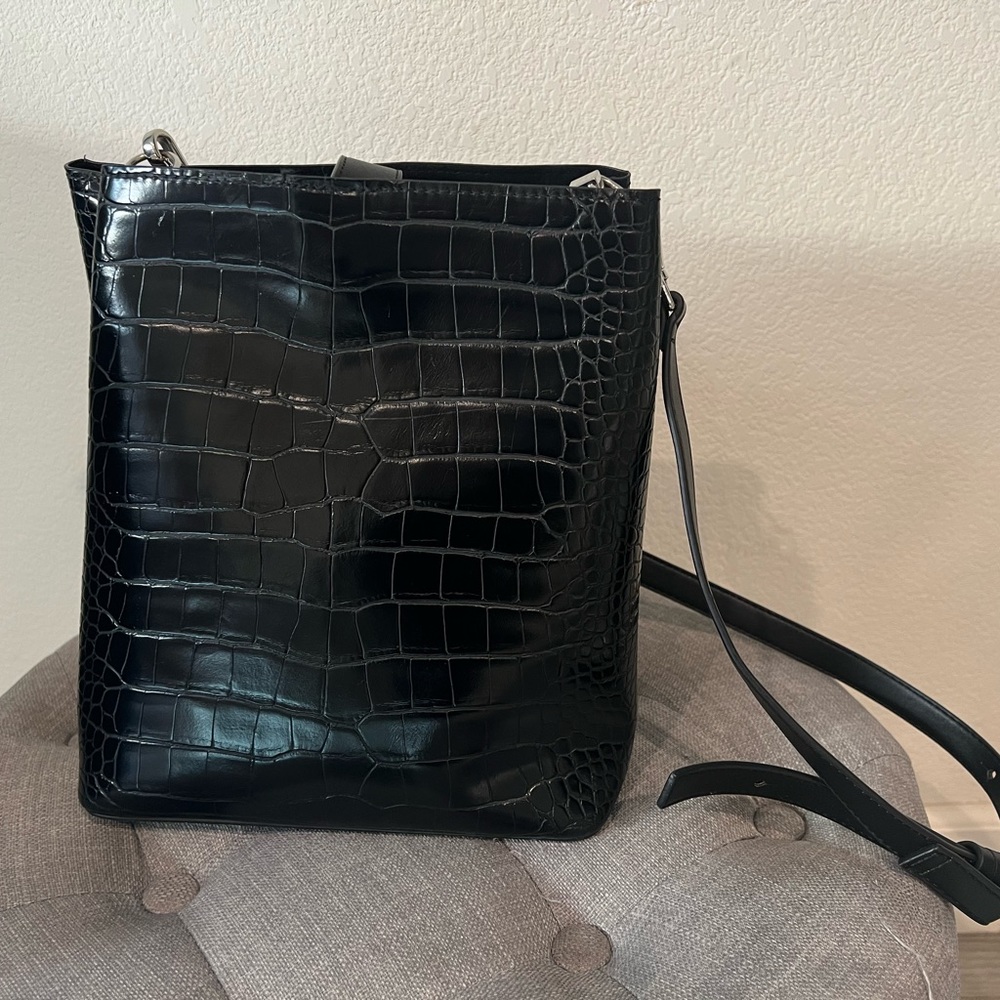 Zara bucket bag with a style of alligator leather.